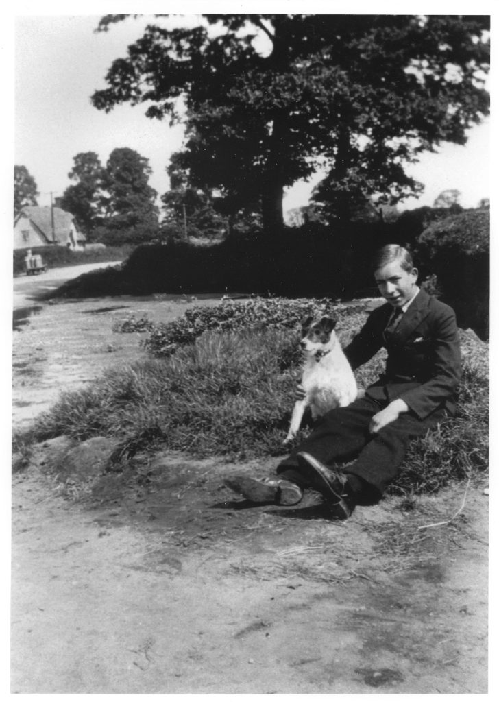 Charlie Rumming with dog "Brandy" by the village pond 1931