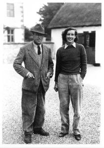 1933. Captain Fielding-Johnson and Mrs Noel Fielding-Johnson. Photo taken in the farmyard at the Manor. They bought the Manor Farm from the CWS in 1930 and soon made great improvements by building another wing onto the house and bringing the farm yards and buildings up to date. He served in both wars, as observer and pilot he was awarded the MC and Bar during World War I. Then in the 2nd he won the DFC at the age of 50, when he was Wing Commander. He was a keen polo player and kept and reared ponies at "the Alley". During the war, Mrs Fielding-Johnson carried on farming, keeping the Eff-Jay herd of dairy shorthorns going. When the Captain died in 1953, Mrs Fielding-Johnson carried on the farm until 1963. During their time at the Manor, they brought new life to the village with much needed employment and help in all other activities.
