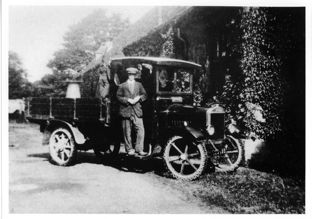 1925. CWS milk delivering lorry outside Compton House stable block. Driver is R.V.J. ‘Jim’ Rumming.