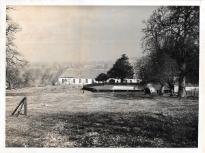 1948. The old stable block converted for dwelling, as the new Compton House. The swimming pool in the foreground is situated in front of the former mansion’s main entrance would have been. Note only a few attic dormer windows at this time.