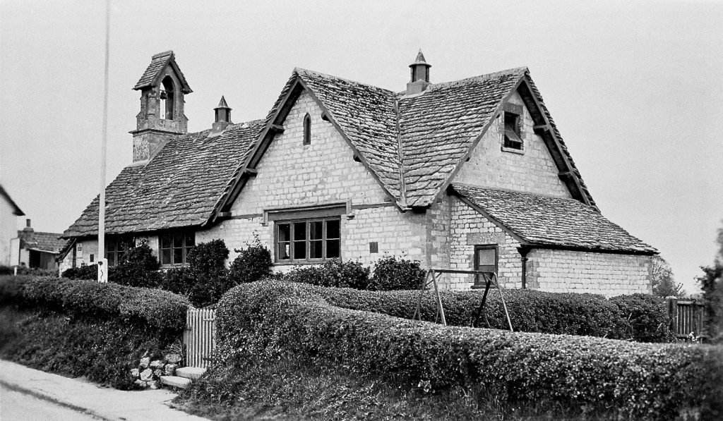 School with flagpole in front garden. 1920s