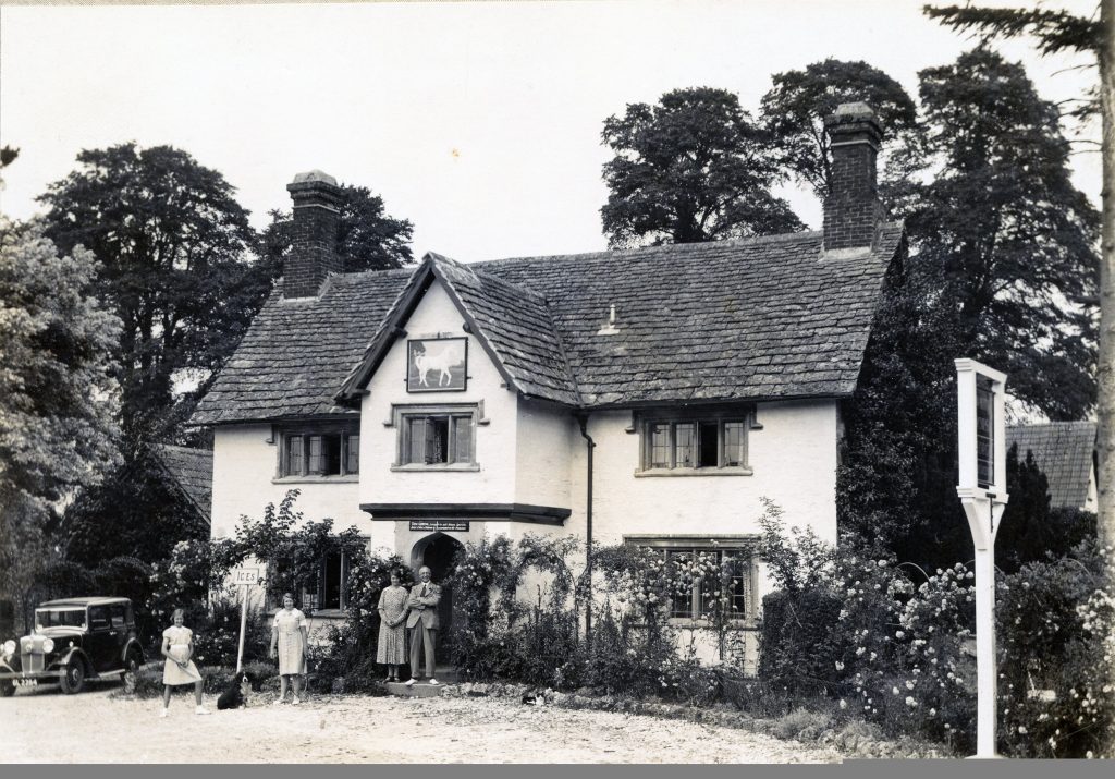 c.1935. White Horse Inn with Tom Goring with wife Gladys and daughters Mary and Joan. Morris Ten saloon car