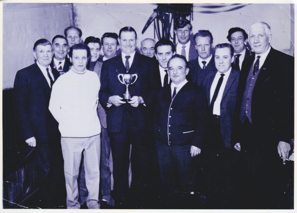 CB Skittles team. Les Smith holding cup 1960s