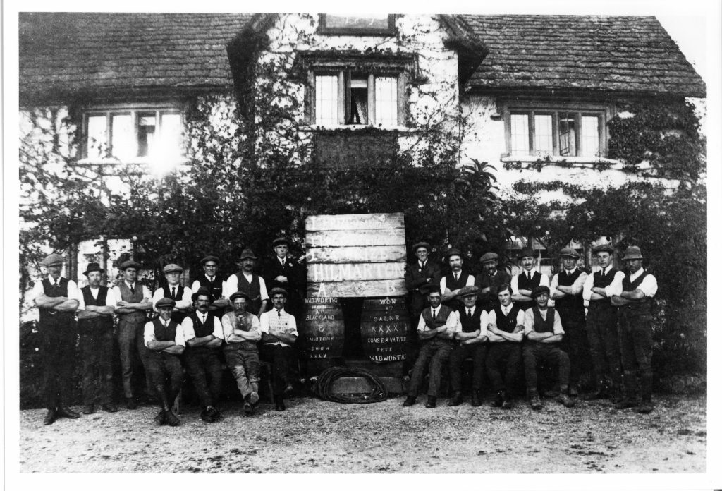 1919 Tug of War Teams A + B at the White Horse Inn, Compton Bassett. Landlord Harold Blackford. Back row (from left). 1. Ernest Taylor; 2. Henry Lewis; 3. Fred Beckett; 4. Bert Goodenough; 5. Bill Rumming; 6. Jack Taylor; 7. Bill Derham. Back Row (right). 1. Fred Smith; 2. Jim Bevington; 3. Arthur Wheeler; 4. Charlie Derham; 5. Harry Evans; 6. Harold Offer; 7. Albert Fell. Front Row (left). 1. Harry Wilkins; 2. Jim Rumming; 3. Bill Cook; 4. Jack Rumming. Front row (right) 1. Charlie Lewis; 2. Fred Bradfield; 3. Ernest Rumming; 4. Jim Wheeler