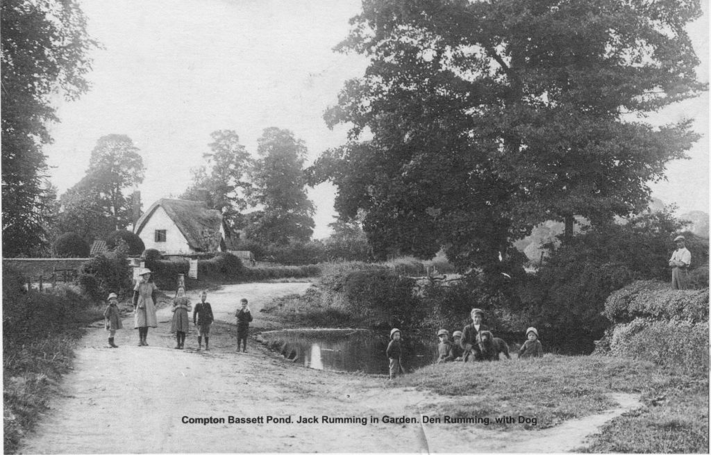1924. The village pond. Jack Rumming and Den Rumming. Manor Cottage in background.